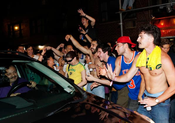 New York Knicks fans celebrate with passing cars on St. Marks Place after the Knicks victory in game five of the NBA, Basketball Herren, USA Finals in San Antonio in the early morning hours of Sunday, June 14, 2026 in New York City. The New York Knicks won the NBA championship defeating the San Antonio Spurs in Game 5 of the NBA Finals to break a 53-year championship drought.  NYP20260613114 JOHNxANGELILLO