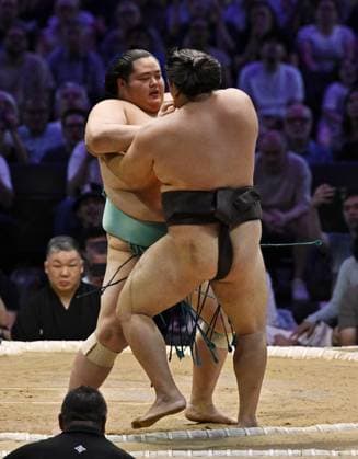 Sumo: Paris tournament Ozeki Kotozakura (back) beats ozeki Kirishima to win the first day of a two-day sumo tournament at Accor Arena in Paris on June 13, 2026.  A14AA0005618712P