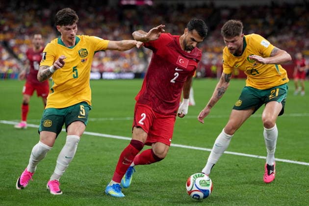 June 13, 2026, Vancouver, Bc, CANADA: Turkey s Zeki Celik (2) tries to move the ball under pressure from Australia s Jordan Bos (5) and teammate Cameron Burgess (21) during first half group D World Cup soccer action, in Vancouver, Saturday, June 13, 2026. AUSTRALIA V. TURKEY  - ZUMAc35_ 20260613_zaf_c35_229 Copyright: xEthanxCairnsx