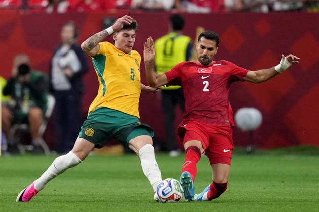 June 13, 2026, Vancouver, Bc, CANADA: Australia s Jordan Bos (5) and Turkey s Zeki Celik (2) vie for the ball during second half group D World Cup soccer action, in Vancouver, Saturday, June 13, 2026. AUSTRALIA V. TURKEY  - ZUMAc35_ 20260613_zaf_c35_239 Copyright: xEthanxCairnsx