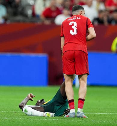 Australia v Turkiye - FIFA World Cup, WM, Weltmeisterschaft, Fussball 2026 - Group D VANCOUVER, CANADA - JUNE 13: Merih Demiral of Turkiye helps his opponent during the 2026 FIFA World Cup First Stage Group D match between Australia and Turkiye at BC Place Stadium in Vancouver, Canada on June 13, 2026. Ercin Erturk Anadolu Vancouver Canada. Editorial use only. Please get in touch for any other usage.  Copyright: x2026xAnadoluxErcinxErturkx