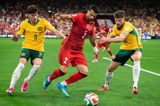 VANCOUVER, CANADA - JUNE 13: Zeki Celik of Turkey controls the ball while Jordan Bos of Australia and Cameron Burgess of Australia follows closely during the FIFA World Cup, WM, Weltmeisterschaft, Fussball 2026 group stage match between Australia and Turkey at BC Place Stadium on June 13, 2026 in Vancouver, British Columbia, Canada.  Copyright: xAmyxElle SPPx Sportspressphoto_SPR166212