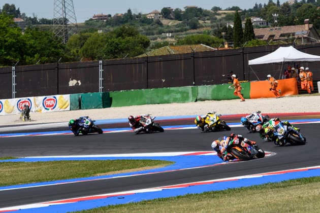 June 14, 2026, Misano Adriatico, Rimini, Italy: Alberto SURRA (ITA) riding for Motocorsa Racing at turn 5 during the Superpole Race of 2026 WorldSBK Pirelli Emilia Romagna round 7 at the Misano World Circuit in Misano Adriatico (Rimini, Italy)..In the background, the crash of Sam LOWES (GBR) riding for ELF Marc VDS Racing Team at turn 4..Credit: ZUMA Press Motorsports 2026: WorldSBK Misano: SPRINT RACE  - ZUMAr158 20260614_aap_r158_002 Copyright: xRiccardoxRighettix