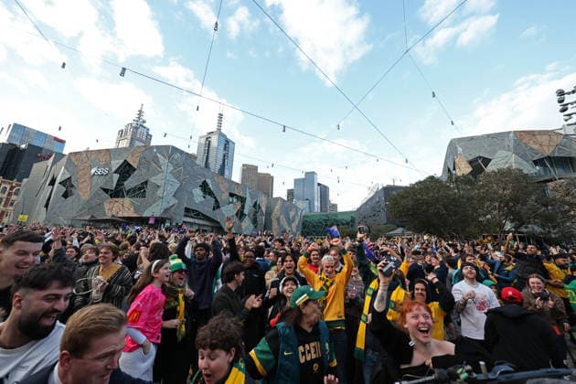 WORLD CUP LIVE SITE, Craig Foster (centre) is seen with fans celebrating the Socceroos win while watching the FIFA World Cup, WM, Weltmeisterschaft, Fussball Group D Australia versus TuÌˆrkiye match live site at Federation Square in Melbourne, Sunday, June 14, 2026. ( NO ARCHIVING Melbourne Victoria Australia  Copyright: xConxChronisx 20260614186257924112