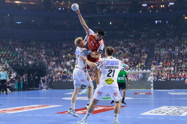 Marinus MUNK Aalborg Handbold, 25 in duel against Magnus SAUGSTRUP SC Magdeburg, 23 GER, Aalborg Handbold vs SC Magdeburg, Handball, TruckScout24 EHF FINAL4 2026, Match for 3rd place, Match time 2025 2026, 14 06 2026,, GER, Aalborg Handbold vs SC Magdeburg, Handball, TruckScout24 EHF FINAL4 2026, Match for 3rd place, Match time 2025 2026, 14 06 2026, Koeln Copyright: xEibnerxPressefoto OliverxSchmidtx EP_OST