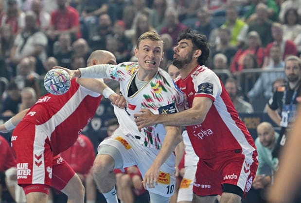 v l Gisli KRISTJANSSON SCM , Marinus Munk AH action, duel Handball Champions League Final Four 2026, match for 3rd place , Aalborg Handbold AH SC Magdeburg MD , on 14 06 2026 in Cologne Germany Â