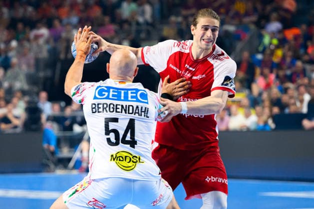 Cologne, Germany Handball EHF CL Final 4 Match 3rd place Aalborg Handbold SC Magdeburg from left in duel Oscar Bergendahl SC Magdeburg and Juri Knorr Aalborg Cologne Lanxess Arena North Rhine-Westphalia Germany