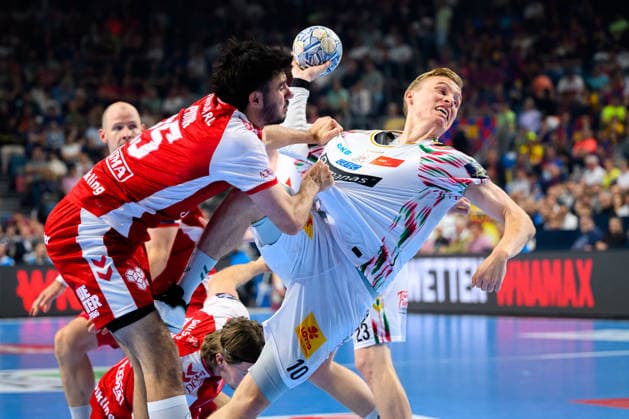 Cologne, Germany Handball EHF CL Final 4 Match 3rd place Aalborg Handbold SC Magdeburg from left in duel Marinus Grandahl Munk Aalborg and Gisli Thorgeir Kristjansson SC Magdeburg Cologne Lanxess Arena North Rhine-Westphalia Germany