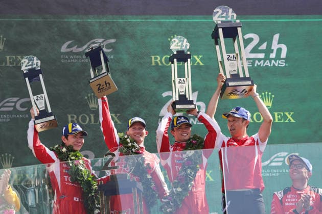 Winner Kamui Kobayashi JPN Mike Conway GBR and Nyck de Vries NED Toyota GR010 Hybrid 7 and Kazuki Nakajima JPN together with the winners trophies on the podium, Race, 24 Hours of Le Mans, France, WEC World Endurance Championship, 14 06 2026, Toyota Gazoo Racing, podium ceremony