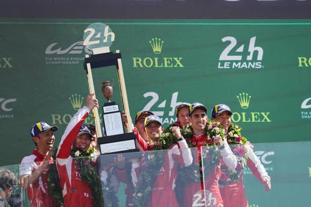 Kazuki Nakajima JPN ,winner Kamui Kobayashi JPN Mike Conway GBR , Nyck de Vries NED Toyota GR010 Hybrid 7 and third placed brendon Hartley NZL , Sebastian Buemi SUI and Ryo Hirakawa JPN together with the overall winners trophy on the podium, Race, 24 Hours of Le Mans, France, WEC World Endurance Championship, 14 06 2026, Toyota Gazoo Racing, Award Ceremony
