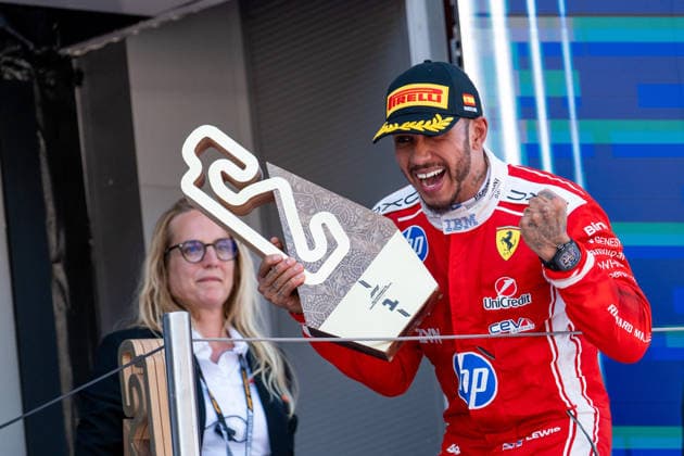 ESP, MSC Cruises Grand Prix of Barcelona Catalunya, Race, Formula 1 World Championship Season 2026 14 06 2026, Circuit de Barcelona Catalunya, Barcelona, ESP, MSC Cruises Grand Prix of Barcelona Catalunya, Race, Formula 1 World Championship Season 2026, in the picture Lewis Hamilton Scuderia Ferrari HP, Great Britain, 44 celebrates his first victory with Ferrari on the podium at the award ceremony with trophy, nordphotoxGmbHx xMemmler nph00005