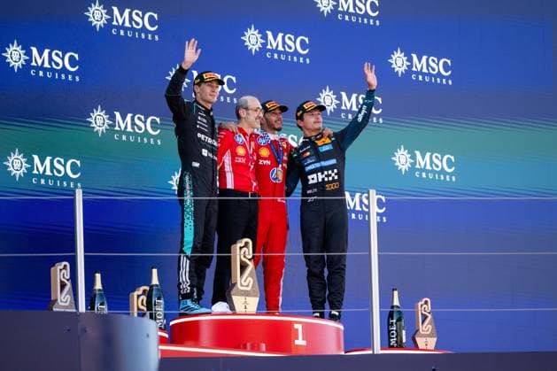 ESP, MSC Cruises Grand Prix of Barcelona Catalunya, Race, Formula 1 World Championship Season 2026 14 06 2026, Circuit de Barcelona Catalunya, Barcelona, ESP, MSC Cruises Grand Prix of Barcelona Catalunya, Race, Formula 1 World Championship Season 2026, in the picture George Russell Mercedes AMG Petronas F1 Team, Great Britain, 63 , Carlos Santi Scuderia Ferrari, race engineer , Lewis Hamilton Scuderia Ferrari HP, Great Britain, 44 , Lando Norris McLaren Mastercard Formula 1 Team, Great Britain, 01 on the podium at the podium ceremony, nordphotoxGmbHx xMemmler nph00005