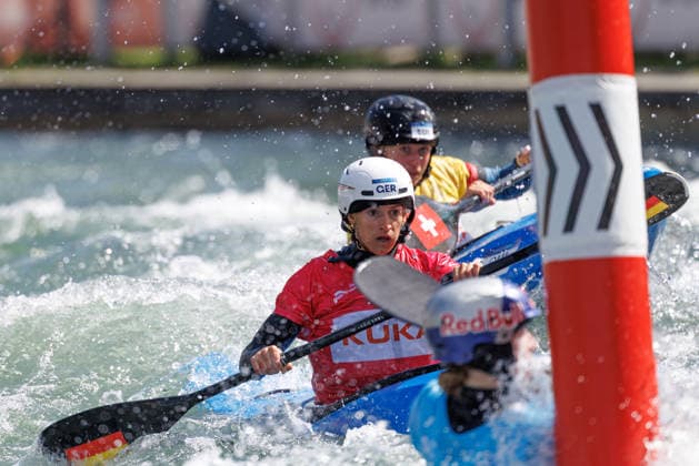 Tereza Kneblova CZE , Evy Leibfarth USA , Alena Marx SUI , Ricarda Funk GER at ICF CANOE SLALOM WORLD CUP, Canoeing, Women, Kayak Cross, 2026, on 14 06 2026 in Augsburg, Eiskanal Bayern Germany