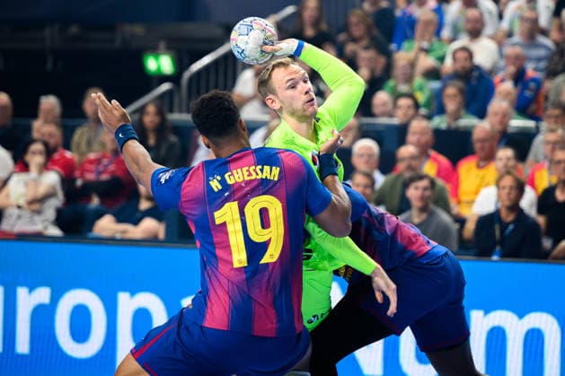 Cologne, Germany Handball EHF CL Final 4 Final Barca Fuechse Berlin from left in duel Timothey N guessan Barcelona , Mathias Gidsel Berlin Cologne Lanxess Arena Nordrhein Westfalen Germany
