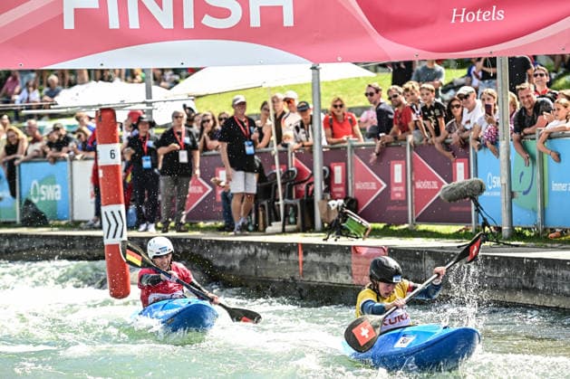 ICF Canoe Slalom World Cup 14 06 2026, Eis Kanal, Augsburg Ricarda Funk red passes the finish as forth after Alena Marx yellow SUI , Augsburg, 14 06 2026 Canoe World Cup, Kayak Cross Elimination, Augsburg, Eis Kanal Copyright: xBEAUTIFULxSPORTS Märklx