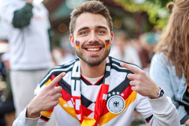 14 06 2026, Cologne, Public Viewing for the FIFA World Cup 2026, International match World Cup Germany Curacao, Fans A fan in the beer garden is looking forward to the game and cheering for the goal of the German national teams victory Feverish excitement North Rhine-Westphalia Germany