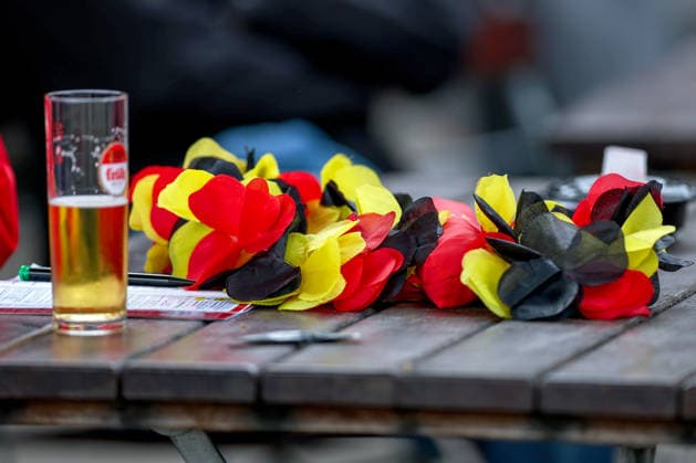 14 06 2026, Cologne, Public Viewing for the FIFA World Cup 2026, international match World Cup Germany Curacao, Germany jewelry on a table in the beer garden next to a glass of Kölsch beer beer glass North Rhine-Westphalia Germany