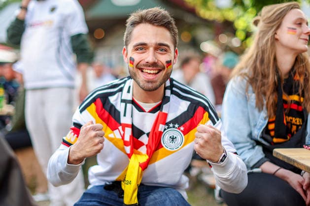 14 06 2026, Cologne, Public Viewing for the FIFA World Cup 2026, International match World Cup Germany Curacao, Fans A fan in the beer garden is looking forward to the game and cheering for the goal of the German national teams victory Feverish excitement North Rhine-Westphalia Germany