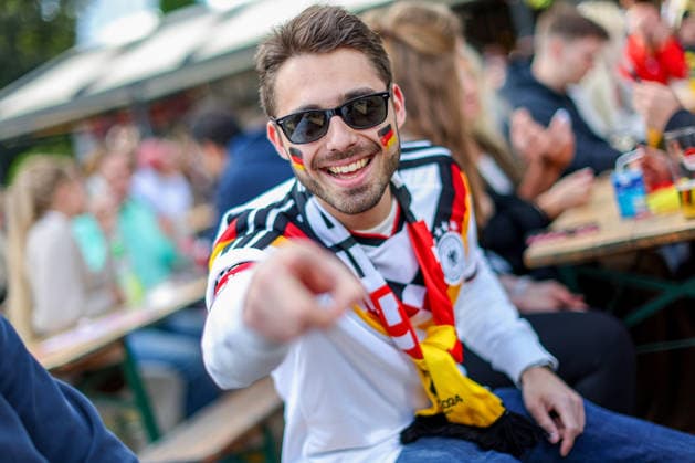 14 06 2026, Cologne, Public Viewing for the FIFA World Cup 2026, International match World Cup Germany Curacao, Fans A fan in the beer garden is looking forward to the game and cheering for the goal of the German national teams victory Feverish excitement North Rhine-Westphalia Germany