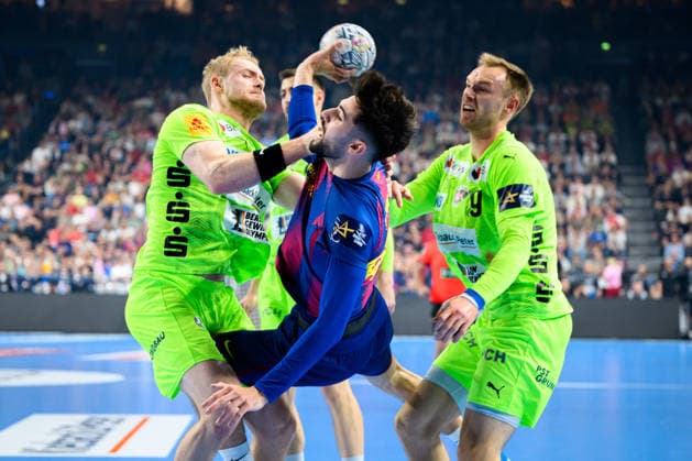 Cologne, Germany Handball EHF CL Final 4 Final Barca Fuechse Berlin from left in duel Matthes Langhoff Berlin , Mathias Gidsel Berlin Cologne Lanxess Arena Nordrhein Westfalen Germany