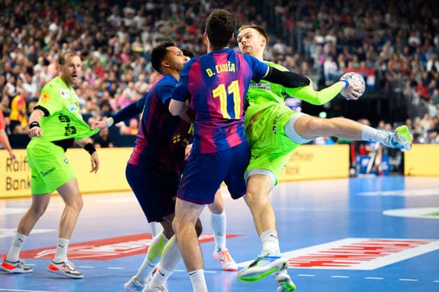 Cologne, Germany Handball EHF CL Final 4 Final Barca Fuechse Berlin from left in duel Djordje Cikusa i Jelicic Barcelona , Mathias Gidsel Berlin Cologne Lanxess Arena Nordrhein Westfalen Germany