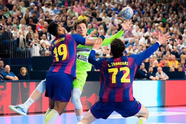 Cologne, Germany Handball EHF CL Final 4 Final Barca Fuechse Berlin from left in duel Timothey N guessan Barcelona and Nils Lichtlein Berlin , Ludovic Fabregas Barcelona Cologne Lanxess Arena Nordrhein Westfalen Germany