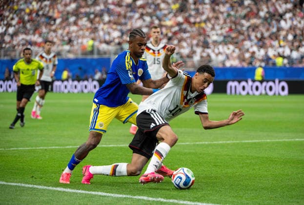 Soccer, Men, FIFA World Cup 2026 in Mexico, Canada and USA, Match in Houston Group E, 1 Matchday , Germany Curacao, v l Juninho Bacuna Curacao , Jamal Musiala Germany , 14 06 2026, Copyright: xMatthiasxKochx