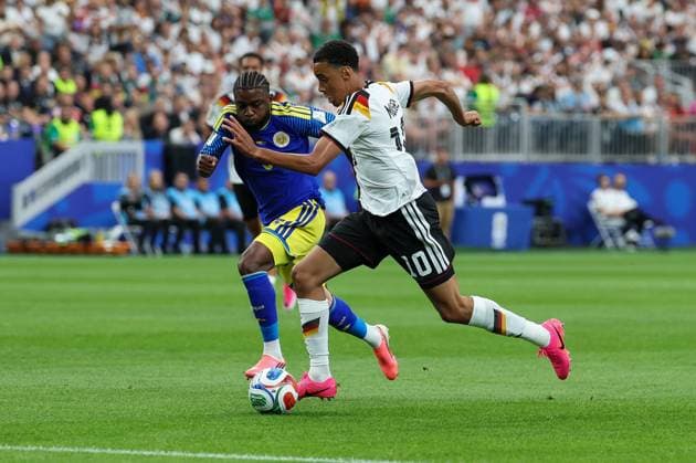 in duel, action, with Sherel Floranus 5 Curacao , Jamal Musiala 10 Germany , Germany vs Curacao, Soccer, World Cup 2026, Group stage, 14 06 2026 Houston Texas USA Copyright: xkolbert-press ChristianxKolbertx