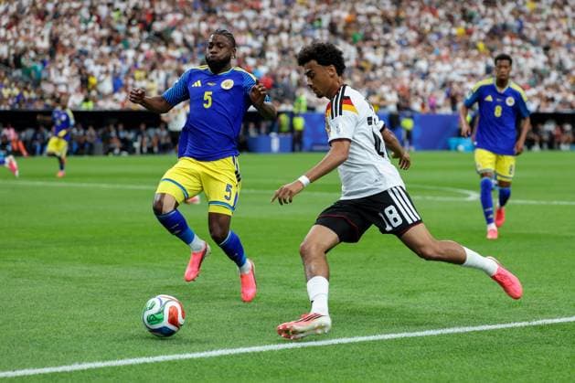 in duel, action, with Sherel Floranus 5 Curacao , Nathaniel Brown 18 Germany , Germany vs Curacao, Soccer, World Cup 2026, Group stage, 14 06 2026 Houston Texas USA Copyright: xkolbert-press ChristianxKolbertx