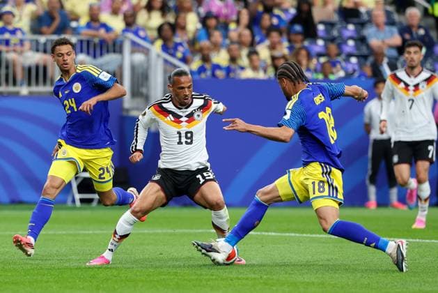 in duel, action, with Deveron Fonville 24 Curacao , Leroy Sane 19 Germany , Armando Obispo 18 Curacao , Germany vs Curacao, Soccer, World Cup 2026, Group stage, 14 06 2026 Houston Texas USA Copyright: xkolbert-press ChristianxKolbertx