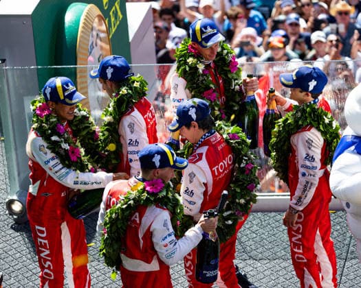24 HEURES DU MANS 2026 - PODIUM 07 CONWAY Mike (gbr), KOBAYASHI Kamui (jpn), DE VRIES Nyck (nld), Toyota Racing, Toyota TR010 Hybrid 07, Hypercar, 08 BUEMI SÃ bastien (swi), HARTLEY Brendon (nzl), HIRAKAWA Ryo (jpn), Toyota Racing, Toyota TR010 Hybrid 08, Hypercar, portrait during the podium of the 24 Hours of Le Mans 2026, 3rd round of the 2026 FIA World Endurance Championship, on June 14, 2026 on the Circuit des 24 Heures du Mans in Le Mans, France -  Copyright: xGERMAINxHAZARDx