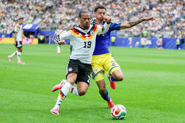 Leroy Sane Germany and Deveron Fonville Curacao battle for the ball during the FIFA World Cup 2026 Group E match between Germany and Curacao at Houston Stadium on June 14, 2026 in Houston, United States Photo by Torbjorn Tande DeFodi Images