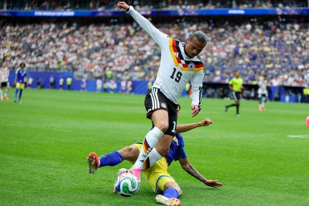 Leroy Sane Germany and Deveron Fonville Curacao battle for the ball during the FIFA World Cup 2026 Group E match between Germany and Curacao at Houston Stadium on June 14, 2026 in Houston, United States Photo by Torbjorn Tande DeFodi Images
