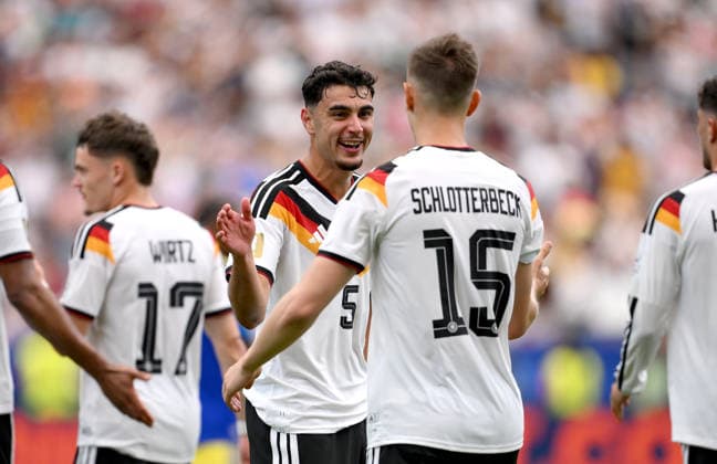 Soccer FIFA World Cup 2026 preliminary round group E in Houston Germany Curacao 14 06 2026 Cheering Germany after the goal to 2 1, from left, Aleksandar Pavlovic with goal scorer Nico Schlotterbeck