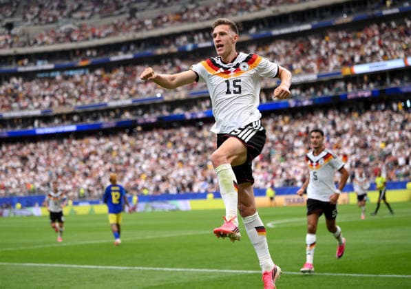 Soccer FIFA World Cup 2026 preliminary round group E in Houston Germany Curacao 14 06 2026 Germany celebrating after the goal to 2 1, from left, goal scorer Nico Schlotterbeck