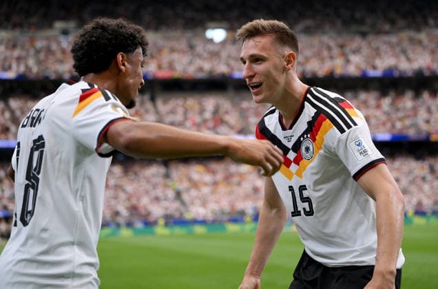 Soccer FIFA World Cup 2026 preliminary round group E in Houston Germany Curacao 14 06 2026 Cheering Germany after the goal to 2 1, from left , Nathaniel Brown with goal scorer Nico Schlotterbeck