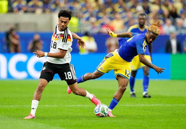 Nathaniel Brown Germany, 18 in duel with Sontje Hansen Curacao, 12 USA, FIFA World Cup, Germany vs Curacao, Houston, 14 06 2026 USA, FIFA World Cup, Germany vs Curacao, Houston, 14 06 2026 Houston Copyright: xEibner-Pressefoto ScottxColemanx EP_SCN