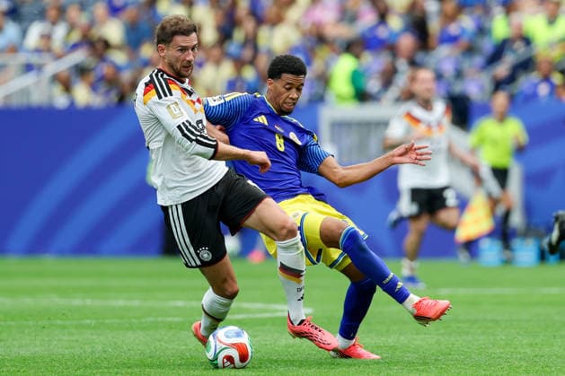 Leon Goretzka Germany and Livano Comenecia Curacao battle for the ball during the FIFA World Cup 2026 Group E match between Germany and Curacao at Houston Stadium on June 14, 2026 in Houston, United States Photo by Torbjorn Tande DeFodi Images
