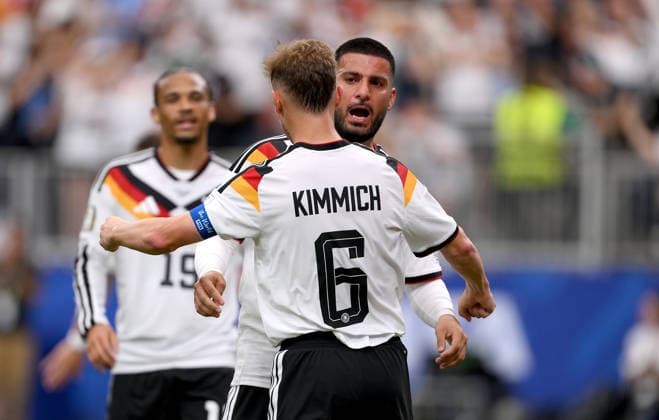 Soccer FIFA World Cup 2026 preliminary round group E in Houston Germany Curacao 14 06 2026 Germany celebrating after the goal to 6 1, from left, Joshua Kimmich with goal scorer Deniz Undav