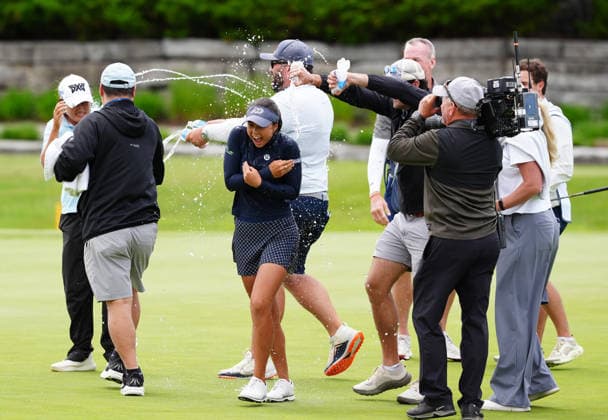 MIDLAND, MI - JUNE 14: LPGA, Golf Damen golfer Yana Wilson gets doused by water from her caddie on June 14, 2026, after winning the LPGA Dow Championship at Midland Country Club in Midland, Michigan. (Photo by Brian Spurlock Icon Sportswire) GOLF: JUN 14 LPGA Dow Championship EDITORIAL USE ONLY Icon26061464