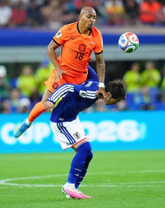 (260615) -- DALLAS, June 15, 2026 -- Kamada Daichi (bottom) of Japan vies with Donyell Malen of the Netherlands during the group F match between the Netherlands and Japan at the 2026 FIFA World Cup, WM, Weltmeisterschaft, Fussball at the Dallas Stadium in Dallas, the United States, on June 14, 2026. ) (SP)U.S.-DALLAS-FOOTBALL-FIFA WORLD CUP-GROUP F-NED VS JPN JiaxHaocheng 
