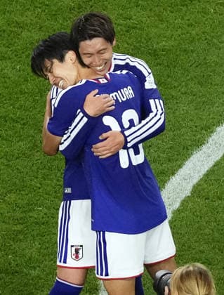 Football: 2026 World Cup Japan s Keito Nakamura (front) and Daichi Kamada hug following a 2-2 draw in a World Cup Group F football match against the Netherlands at Dallas Stadium in Arlington, Texas, on June 14, 2026.  A14AA0005618858P