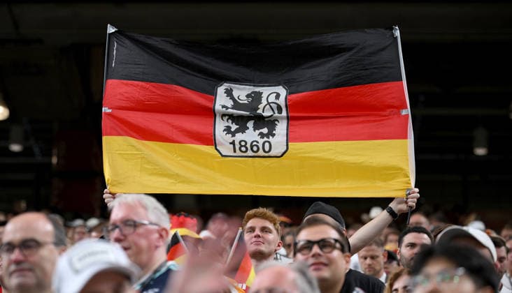 Soccer FIFA World Cup 2026 preliminary round group E in Houston Germany Curacao 14 06 2026 Germany fan with flag and the TSV 1860 Muenchen logo