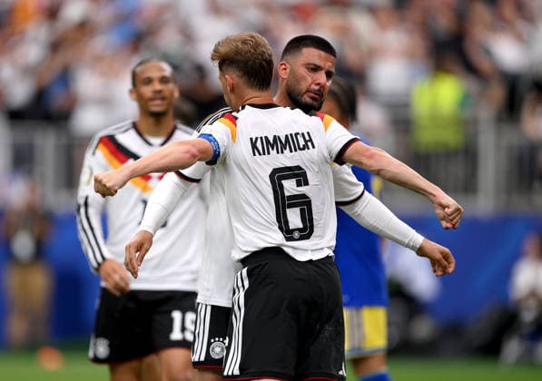 Soccer FIFA World Cup 2026 preliminary round group E in Houston Germany Curacao 14 06 2026 Germany celebrating after the goal to 6 1, from left, Joshua Kimmich with goal scorer Deniz Undav