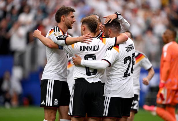 Soccer FIFA World Cup 2026 preliminary round group E in Houston Germany Curacao 14 06 2026 Germany celebrate after scoring the 6 1 goal, from left , Leon Goretzka, Joshua Kimmich , Leroy Sane with goal scorer Deniz Undav