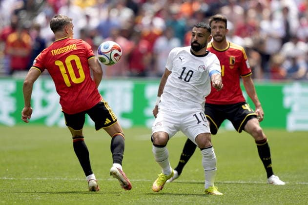 FIFA World Cup, WM, Weltmeisterschaft, Fussball 2026 - Group G - Belgium vs Egypt Leandro Trossard (L) and Brandon Mechele of Belgium in action against Mohamed Salah (C) of Egypt during the FIFA World Cup 2026 group stage match Belgium against Egypt, in Seattle, USA, 15 June 2026. SEATTLE United States  Copyright: xSTEPHENxBRASHEARx