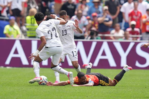 Belgium v Egypt - FIFA World Cup, WM, Weltmeisterschaft, Fussball 2026 - Group G SEATTLE, UNITED STATES - JUNE 15: Omar Marmoush (22), and Ahmed Fatouh (13) of Belgium in action against Youri Tielemans (ground) of Belgium during the 2026 FIFA World Cup First Stage Group G match between Belgium and Egypt at Lumen Field (Seattle Stadium) in Seattle, Washington, United States on June 15, 2026. Ercin Erturk Anadolu Washington United States. Editorial use only. Please get in touch for any other usage.  Copyright: x2026xAnadoluxErcinxErturkx