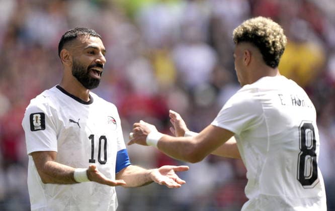 FIFA World Cup, WM, Weltmeisterschaft, Fussball 2026 - Group G - Belgium vs Egypt epaselect Emam Ashour (R) of Egypt celebrates with teammate Mohamed Salah (L) after scoring the opening goal during the FIFA World Cup 2026 group stage match Belgium against Egypt, in Seattle, USA, 15 June 2026. SEATTLE United States  Copyright: xSTEPHENxBRASHEARx