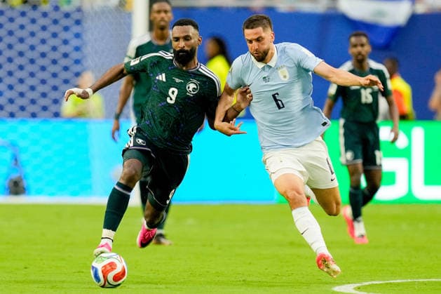 Feras Albrikan of Saudi Arabia and Rodrigo Bentancur of Uruguay battle for the ball during the 2026 FIFA World Cup Group H match between Saudi Arabia and Uruguay at Miami Stadium on June 15, 2026, in Miami, United States. Photo by Alex Gottschalk, DeFodi Images,detected_source_language