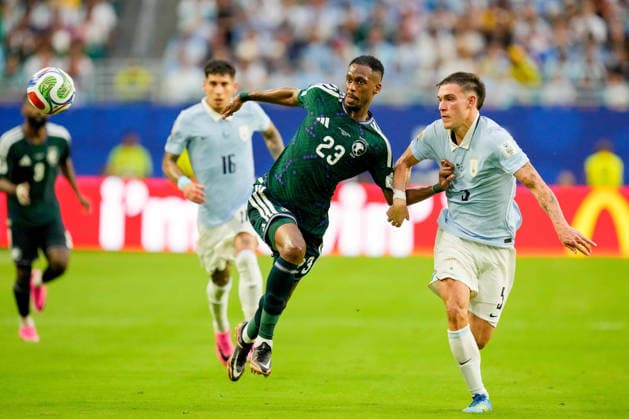 Mohamed Kanno of Saudi Arabia and Manuel Ugarte of Uruguay battle for the ball during the 2026 FIFA World Cup Group H match between Saudi Arabia and Uruguay at Miami Stadium on June 15, 2026, in Miami, United States. Photo by Alex Gottschalk, DeFodi Images,detected_source_language